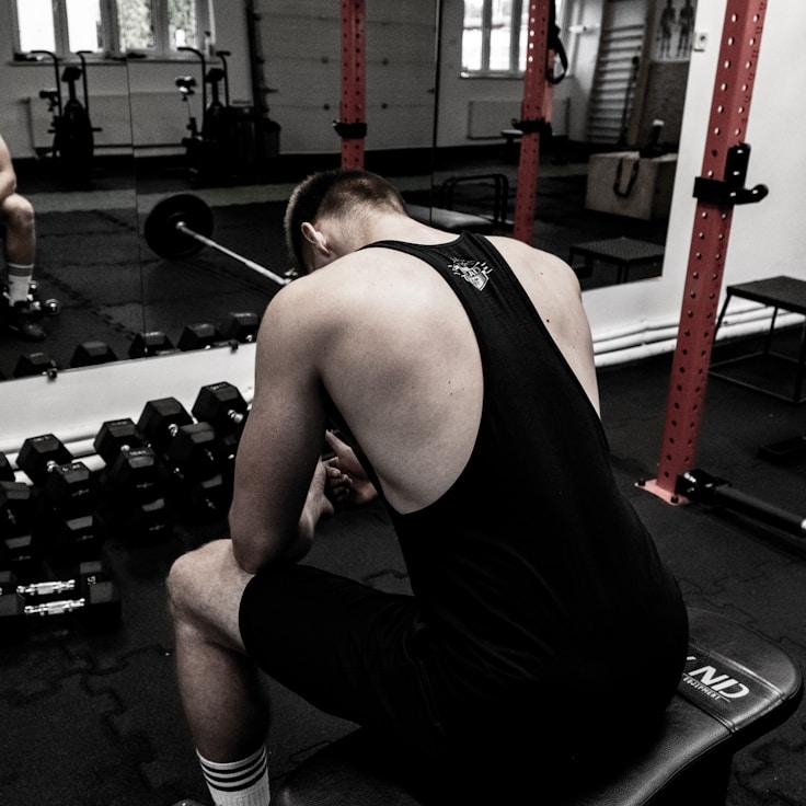 Interior of a professional gym with weight training equipment and mirrors